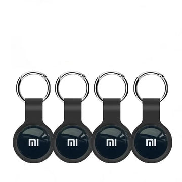 Four black Mi keychain devices with the Mi logo on a white background.